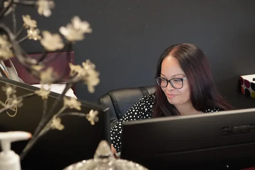 Small business owners meeting with their CPA in Manassas, VA about bookkeeping, tax, and advisory support.